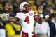 Nov 9, 2013; Ann Arbor, MI, USA; Nebraska Cornhuskers quarterback Tommy Armstrong Jr. (4) passes the ball in the third quarter against the Michigan Wolverines at Michigan Stadium. Nebraska won 17-13. Mandatory Credit: Rick Osentoski-USA TODAY Sports