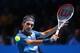 LONDON, ENGLAND - NOVEMBER 10: Roger Federer of Switzerland plays a backhand during his men's singles semi-final match against Rafael Nadal of Spain during day seven of the Barclays ATP World Tour Finals at O2 Arena on November 10, 2013 in London, Englan