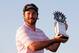 ANTALYA, TURKEY - NOVEMBER 10: Victor Dubuisson of France poses with the trophy after winning the Turkish Airlines Open at The Montgomerie Maxx Royal Course on November 10, 2013 in Antalya, Turkey. (Photo by Dean Mouhtaropoulos/Getty Images)