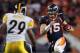 DENVER, CO - JANUARY 08: Quarterback Tim Tebow #15 of the Denver Broncos is pursued by Ryan Mundy #29 of the Pittsburgh Steelers during the AFC Wild Card Playoff game at Sports Authority Field at Mile High on January 8, 2012 in Denver, Colorado. The Bron