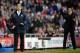 SUNDERLAND, ENGLAND - NOVEMBER 10: Manager of Manchester City Manuel Pellegrini and Manager of Sunderland Gus Poyet shout instructions during the Barclays Premier League match between Sunderland and Manchester City at the Stadium of Light on November 10,