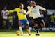 LONDON, ENGLAND - NOVEMBER 10: (L-R) Loic Remy of Newcastle United holds off the challenge of Raniere Sandro of Tottenham Hotspur during the Barclays Premier League match between Tottenham Hotspur and Newcastle United at White Hart Lane on November 10, 2