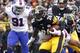 PITTSBURGH, PA - NOVEMBER 10: Le'Veon Bell #26 of the Pittsburgh Steelers rushes against Manny Lawson #91 of the Buffalo Bills during the game on November 10, 2013 at Heinz Field in Pittsburgh, Pennsylvania. (Photo by Justin K. Aller/Getty Images)