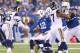 INDIANAPOLIS, IN - NOVEMBER 10: Andrew Luck #12 of the Indianapolis Colts fumbles the ball during the game against the St. Louis Rams at Lucas Oil Stadium on November 10, 2013 in Indianapolis, Indiana. (Photo by Andy Lyons/Getty Images)