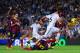 BARCELONA, SPAIN - OCTOBER 26: Sami Khedira of Real Madrid CF duels for the ball with Gerard Pique of FC Barcelona the La Liga match between FC Barcelona and Real Madrid CF at Camp Nou on October 26, 2013 in Barcelona, Spain. (Photo by David Ramos/Getty