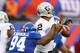 EAST RUTHERFORD, NJ - NOVEMBER 10: Mathias Kiwanuka #94 of the New York Giants strips the ball from Terrelle Pryor #2 of the Oakland Raiders in the fourth quarter during their game at MetLife Stadium on November 10, 2013 in East Rutherford, New Jersey.