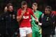 MANCHESTER, ENGLAND - NOVEMBER 10: Nemanja Vidic of Manchester United is helped from the pitch after sustaining an injury during the Barclays Premier League match between Manchester United and Arsenal at Old Trafford on November 10, 2013 in Manchester, E