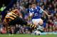 LIVERPOOL, ENGLAND - OCTOBER 19: Leighton Baines of Everton is tackled by Jake Livermore of Hull City during the Barclays Premier League match between Everton and Hull City at Goodison Park on October 19, 2013 in Liverpool, England. (Photo by Clive Bruns
