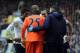 Lloris is attended to by medical staff and teammates at Goodison Park.