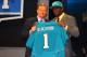 NEW YORK, NY - APRIL 26: Justin Blackmon (R) from Oklahoma State holds up a jersey as he stands on stage with NFL Commissioner Roger Goodell after he was selected #5 overall by the Jacksonville Jaguars in the first round of the 2012 NFL Draft at Radio Ci