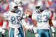 ORCHARD PARK, NY - OCTOBER 4: Wide receiver Mark Duper #85 and Mark Clayton #83 of the Miami Dolphins talk during a game against the Buffalo Bills at Ralph Wilson Stadium on October 4, 1992 in Orchard Park, New York. The Dolphins won 37-10. (Photo by R