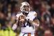 FAYETTEVILLE, AR - NOVEMBER 2: Nick Marshall #14 of the Auburn Tigers looks downfield for a reliever against the Arkansas Razorbacks at Razorback Stadium on November 2, 2013 in Fayetteville, Arkansas. The Tigers defeated the Razorbacks 35-17. (Photo by