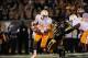 Nov 2, 2013; Columbia, MO, USA; Tennessee Volunteers quarterback Joshua Dobbs (11) scrambles behind the line as Missouri Tigers defensive lineman Shane Ray (56) attempts the sack during the second half of the game at Faurot Field. Missouri won 31-3. Manda