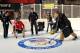 NEW YORK, NY - OCTOBER 29: A guest participates in a curling demo during the USOC 100 Days Out 2014 Sochi Winter Olympics Celebration at Times Square on October 29, 2013 in New York City. (Photo by D Dipasupil/Getty Images for USOC)