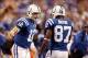 Oct 20, 2013; Indianapolis, IN, USA; Indianapolis Colts quarterback Andrew Luck (12) reacts with wide receiver Reggie Wayne (87) during the game against the Denver Broncos at Lucas Oil Stadium. Mandatory Credit: Brian Spurlock-USA TODAY Sports