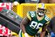 GREEN BAY, WI - NOVEMBER 10: Brandon Bostick #86 of the Green Bay Packers celebrates a third quarter touchdown behind Roc Carmichael #21 of the Philadelphia Eagles at Lambeau Field on November 10, 2013 in Green Bay, Wisconsin. Philadelphia won the game 2