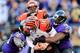BALTIMORE, MD - NOVEMBER 10: Quarterback Andy Dalton #14 of the Cincinnati Bengals is sacked by outside linebacker Elvis Dumervil #58 of the Baltimore Ravens during the second half of the Ravens 20-17 overtime win at M&T Bank Stadium on November 10, 2013