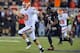 LUBBOCK, TX - NOVEMBER 2: Quarterback Clint Chelf #10 of the Oklahoma State Cowboys breaks a long run for a touchdown against the Texas Tech Red Raiders during game action on November 2, 2013 at AT&T Jones Stadium in Lubbock, Texas. Oklahoma State won the