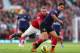 MANCHESTER, ENGLAND - NOVEMBER 03: Wayne Rooney of Manchester United tangles with Mikel Arteta of Arsenal during the Barclays Premier League match between Manchester United and Arsenal at Old Trafford on November 3, 2012 in Manchester, England. (Photo by