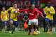 MANCHESTER, ENGLAND - NOVEMBER 10: Patrice Evra of Manchester United battle for the ball with Jack Wilshere of Arsenal during the Barclays Premier League match between Manchester United and Arsenal at Old Trafford on November 10, 2013 in Manchester, Engl