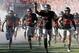 Nov. 9, 2013; Stillwater, OK, USA; Oklahoma State Cowboys run out to the field before the game against the Kansas Jayhawks at Boone Pickens Stadium. Mandatory Credit: Richard Rowe-USA TODAY Sports
