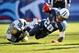 NASHVILLE, TN - NOVEMBER 10: Running back Chris Johnson #28 of the Tennessee Titans is tackled as he rushes against the Jacksonville Jaguars at LP Field on November 10, 2013 in Nashville, Tennessee. (Photo by Frederick Breedon/Getty Images)