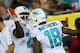 TAMPA, FL - NOVEMBER 11: Rishard Matthews #18 and Lamar Miller #26 of the Miami Dolphins celebrate a second quarter touchdown against the Tampa Bay Buccaneers at Raymond James Stadium on November 11, 2013 in Tampa, Florida. (Photo by Mike Ehrmann/Gett