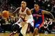 Nov 11, 2013; Portland, OR, USA; Portland Trail Blazers point guard Damian Lillard (0) drives to the basket past Detroit Pistons point guard Brandon Jennings (7) during the fourth quarter of the game at Moda Center. The Blazers won the game 109-103. Manda