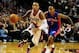 Nov 11, 2013; Portland, OR, USA; Portland Trail Blazers point guard Damian Lillard (0) drives to the basket past Detroit Pistons point guard Brandon Jennings (7) during the fourth quarter of the game at Moda Center. The Blazers won the game 109-103. Manda