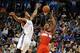 Nov 10, 2013; Oklahoma City, OK, USA; Washington Wizards shooting guard Bradley Beal (3) attempts a shot against Oklahoma City Thunder small forward Perry Jones (3) during the second quarter at Chesapeake Energy Arena. Mandatory Credit: Mark D. Smith-USA