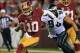 Sep 9, 2013; Landover, MD, USA; Washington Redskins quarterback Robert Griffin III (10) runs with the ball as Philadelphia Eagles outside linebacker Connor Barwin (98) chases in the second quarter at FedEx Field. Mandatory Credit: Geoff Burke-USA TODAY Sp