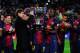 BARCELONA, SPAIN - MAY 19: Head coach Tito Vilanova and Eric Abidal of FC Barcelona holds up the trophy during the celebration after winning the Spanish League after the La Liga match between FC Barcelona and Real Valladolid CF at Camp Nou on May 19, 201