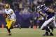 MINNEAPOLIS, MN - NOVEMBER 7: Robert Griffin III #10 of the Washington Redskins scrambles with the ball after pressure by Jared Allen #69 and Brian Robison #96 of the Minnesota Vikings during the third quarter of the game on November 7, 2013 at Mall of Am