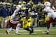 Nov 9, 2013; Ann Arbor, MI, USA; Nebraska Cornhuskers defensive end Jason Ankrah (9) and linebacker Michael Rose (15) move to tackle Michigan Wolverines running back Fitzgerald Toussaint (28) in the third quarter at Michigan Stadium. Mandatory Credit: Ric