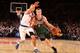 NEW YORK, NY - OCTOBER 30: Nate Wolters #6 of the Milwaukee Bucks drives against Pablo Prigioni #9 of the New York Knicks during the first regular season game at the newly transformed Madison Square Garden in New York City on October 30, 2013. NOTE TO US