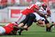 COLUMBUS, OH - SEPTEMBER 7: Michael Bennett #63 of the Ohio State Buckeyes sacks quarterback Quinn Kaehler #18 of the San Diego State Aztecs and causes a fumble in the second quarter that Bennett recovered at Ohio Stadium on September 7, 2013 in Columbus