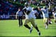 Oct 26, 2013; Charlottesville, VA, USA; Georgia Tech Yellow Jackets running back David Sims (20) scores a touchdown with 1:55 left in the fourth quarter as offensive linesman Will Jackson (52) celebrates in the background. The Jackets defeated the Virgin