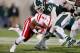 EAST LANSING, MI - NOVEMBER 03: Kurtis Drummond #27 of the Michigan State Spartans tackles Ameer Abdullah #8 of the Nebraska Cornhuskers during fourth quarter action at Spartan Stadium Stadium on November 3, 2012 in East Lansing, Michigan. Nebraska won t