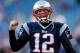 FOXBORO, MA - NOVEMBER 3: Tom Brady #12 of the New England Patriots reacts to the cheers of fans as he runs onto the field before a game with the Pittsburgh Steelers at Gillette Stadium on November 3, 2013 in Foxboro, Massachusetts. (Photo by Jim Rogash/G