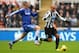 NEWCASTLE UPON TYNE, ENGLAND - NOVEMBER 02: Yoan Gouffran (R) of Newcastle United is challenged by Fernando Torres of Chelsea during the Barclays Premier League match between Newcastle United and Chelsea at St James' Park on November 02, 2013 in Newcastle