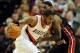Mar. 1, 2012; Portland, OR, USA; Portland Trail Blazers power forward LaMarcus Aldridge (12) drives to the basket as Miami Heat small forward LeBron James (6) defends during the third quarter at the Rose Garden. The Heat won the game 107-93. Mandatory Cre
