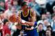 PORTLAND, OR - 1986: Alex English #2 of the Denver Nuggets passes against the Portland Trail Blazers during a game played in 1986 at the Veterans Memorial Coliseum in Portland, Oregon. NOTE TO USER: User expressly acknowledges and agrees that, by download