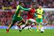 LONDON, ENGLAND - OCTOBER 19: Jack Wilshere of Arsenal evades Martin Olsson of Norwich City during the Barclays Premier League match between Arsenal and Norwich City at Emirates Stadium on October 19, 2013 in London, England. (Photo by Paul Gilham/Getty