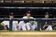 Aug 26, 2013; Detroit, MI, USA; Detroit Tigers starting pitcher Max Scherzer (left), starting pitcher Rick Porcello (center) and starting pitcher Justin Verlander (right) watch from the dugout in the seventh inning against the Oakland Athletics at Comeric