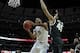 Nov 12, 2013; Chicago, IL, USA; Kentucky Wildcats guard Andrew Harrison (5) shoots over Michigan State Spartans guard Denzel Valentine (45) during the first half at the United Center. Mandatory Credit: David Banks-USA TODAY Sports