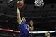 Nov 12, 2013; Chicago, IL, USA; Kansas Jayhawks forward Perry Ellis (34) shoots over Duke Blue Devils forward Jabari Parker (1) during the second half at United Center. The Kansas Jayhawks defeated the Duke Blue Devils 94-83. Mandatory Credit: David Banks