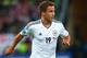 GDANSK, POLAND - JUNE 22: Mario Gotze of Germany runs with the ball during the UEFA EURO 2012 quarter final match between Germany and Greece at The Municipal Stadium on June 22, 2012 in Gdansk, Poland. (Photo by Alex Grimm/Getty Images)
