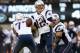 EAST RUTHERFORD, NJ - OCTOBER 20: Tom Brady #12 of the New England Patriots looks for an open man against the New York Jets during their game at MetLife Stadium on October 20, 2013 in East Rutherford, New Jersey. (Photo by Jeff Zelevansky/Getty Images)