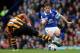 LIVERPOOL, ENGLAND - OCTOBER 19: Leighton Baines of Everton is tackled by Jake Livermore of Hull City during the Barclays Premier League match between Everton and Hull City at Goodison Park on October 19, 2013 in Liverpool, England. (Photo by Clive Bruns