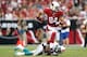 GLENDALE, AZ - SEPTEMBER 30: Tight end Rob Housler #84 of the Arizona Cardinals runs with the football after a reception against the Miami Dolphins during the NFL game at the University of Phoenix Stadium on September 30, 2012 in Glendale, Arizona. The